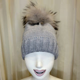 Cappello grigio GIO HIGUAMY misto lana con  pompon in mourmansky