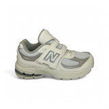 Sneakers ginniche NEWBALANCE 2002 panna con strap e lacci elastici